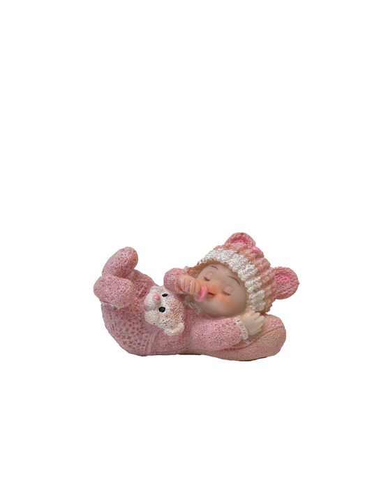 Figurine bébé sur coussin
